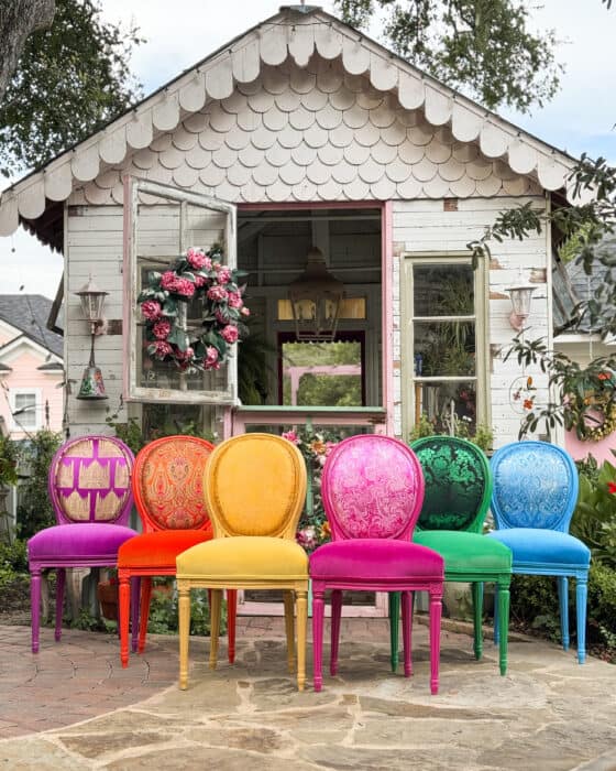 Rainbow colored chairs in full dip of colors.
