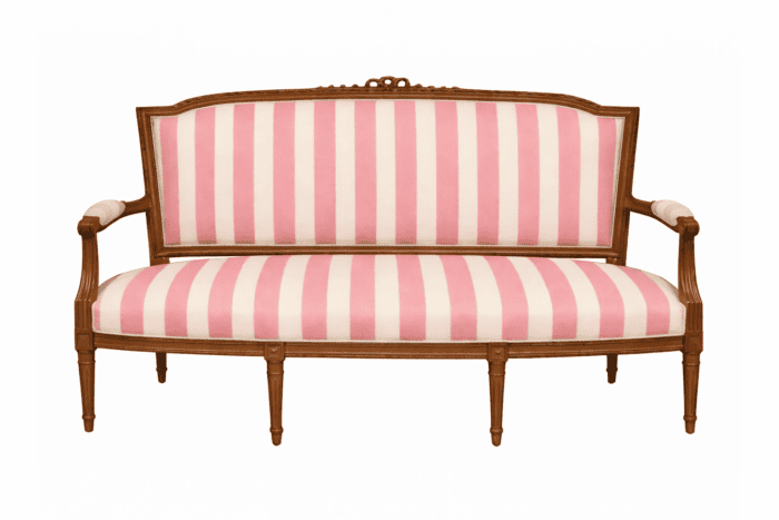 Settee with brown wood and pink and white stripe.