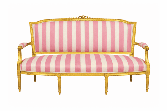 Gold painted settee with pink and white stripe fabric.