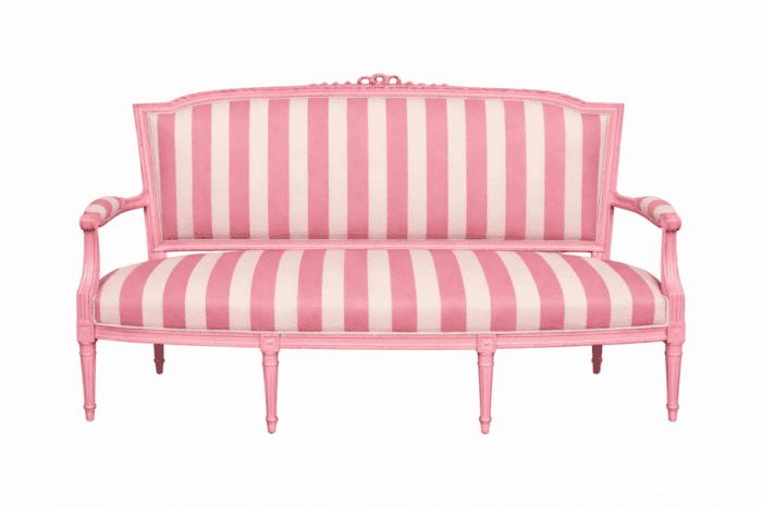 Pink painted settee with pink and white stripe fabric.
