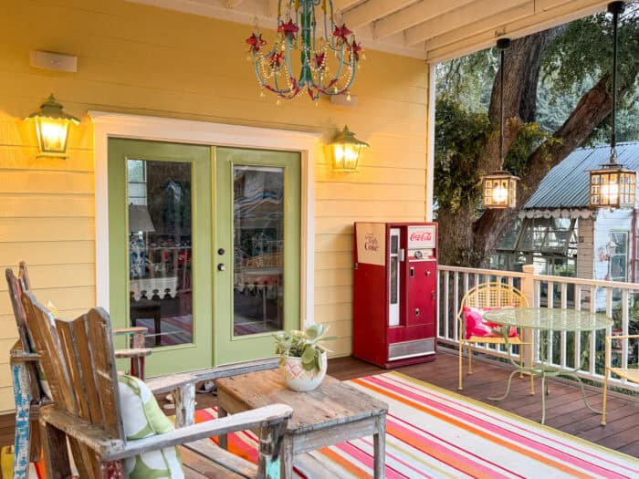 Kiwi green French doors with Coca-Cola machine and striped rug
