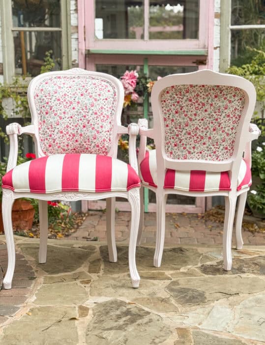 Pink painted chairs with ditsy print on top and bold pink striped seats.