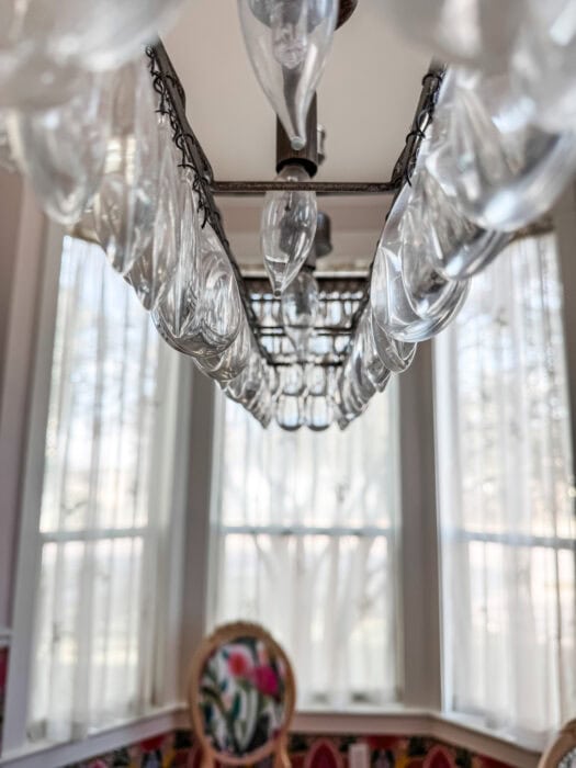 The underside of the chandelier showing the bars where I will hang the ribbon