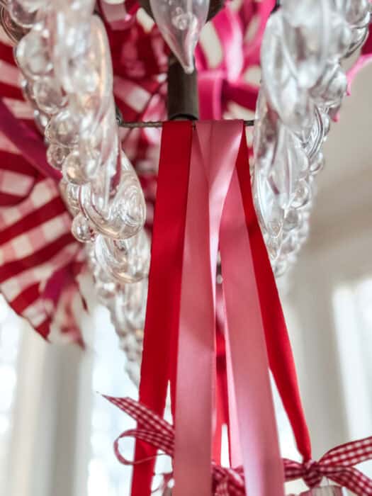 Underside of the chandelier showing how the ribbon hangs from the bars