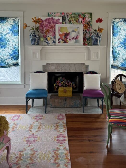 Before picture of the fireplace with old tile and layered art.