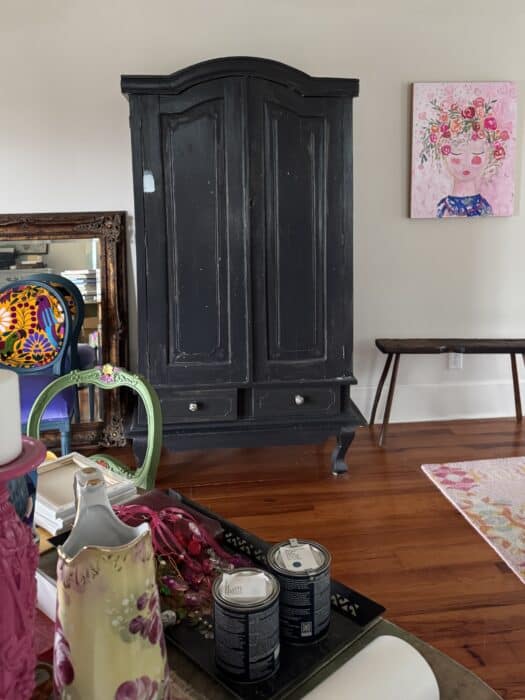 Before picture of black armoire.