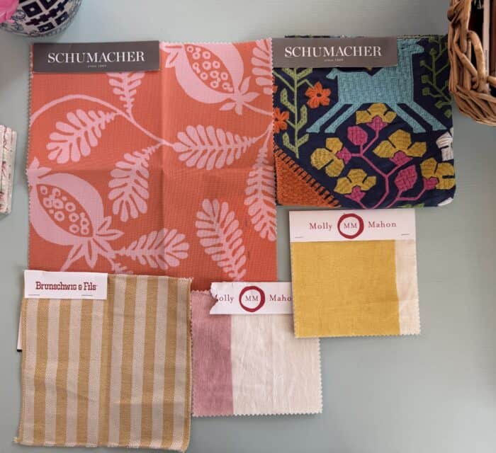 Different fabrics in orange, yellow, pink, and blue.