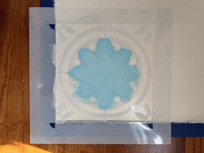Stencil with first layer of paint.