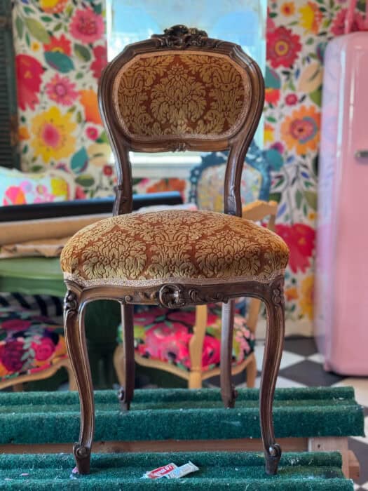 Before chair picture with brown frame and brown fabric.