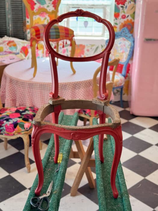 Small chair painted in red.
