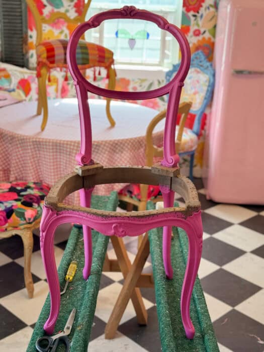 Small chair painted in pink.