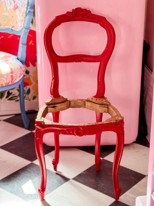 Chair frame painted in red.