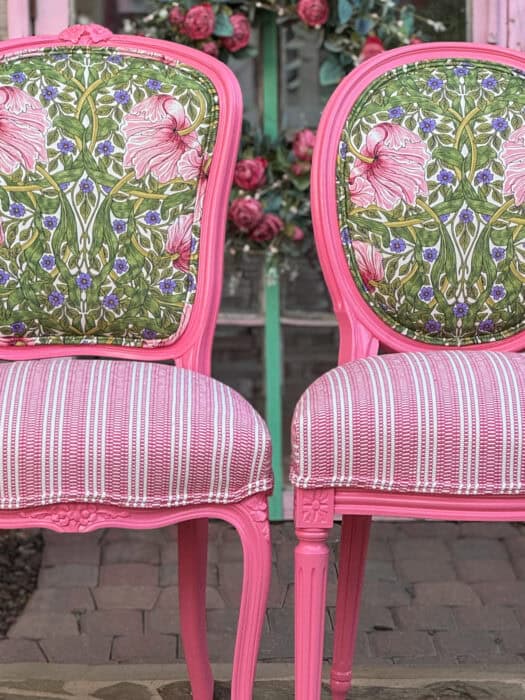 A close in shot of the finished chairs with the floral and pink striped seats. 