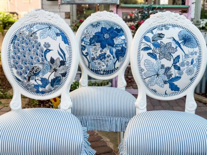 Dining chairs showing Lansdale Bouquet fabric by Schumacher on the top and a pin stripe on the seat.