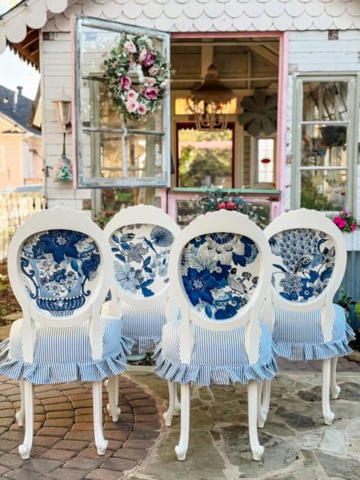4 dining chairs showing Lansdale Bouquet fabric by Schumacher. 