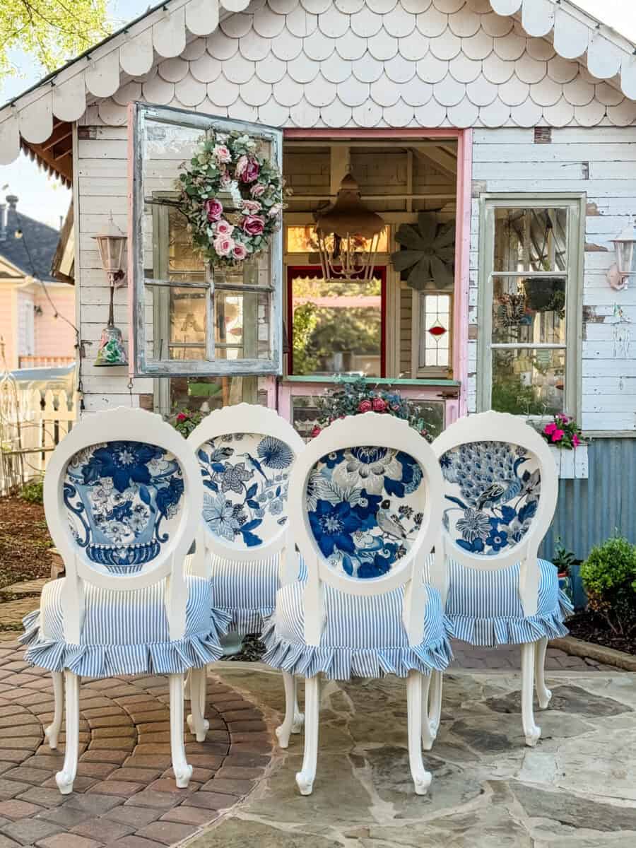 4 dining chairs showing Lansdale Bouquet fabric by Schumacher.