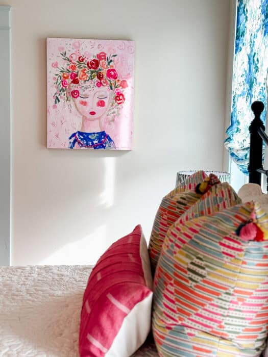 Carrie Schmitt art with pillows in the foreground.