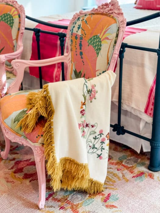 Chair with a draped blanket.