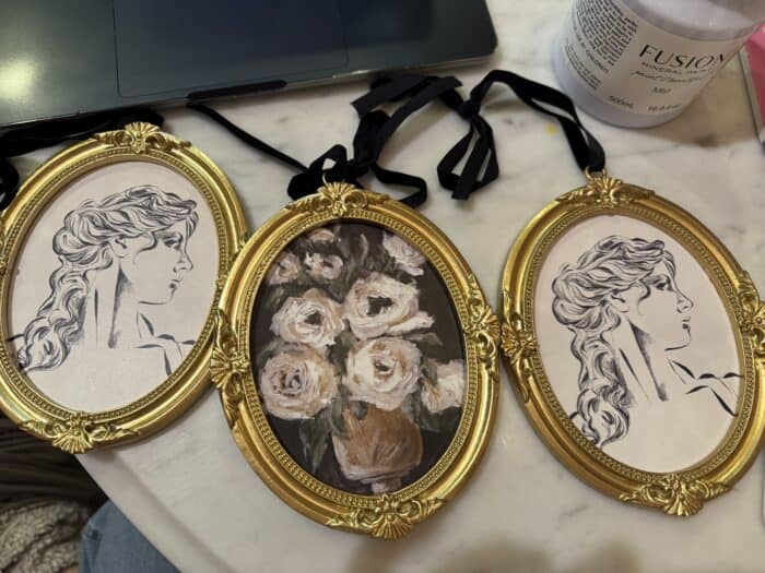 Frames with pictures of a lady and flowers.