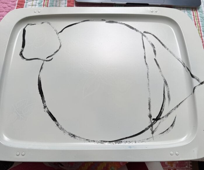 basic outline sketched onto a tray before painting a tablescape design